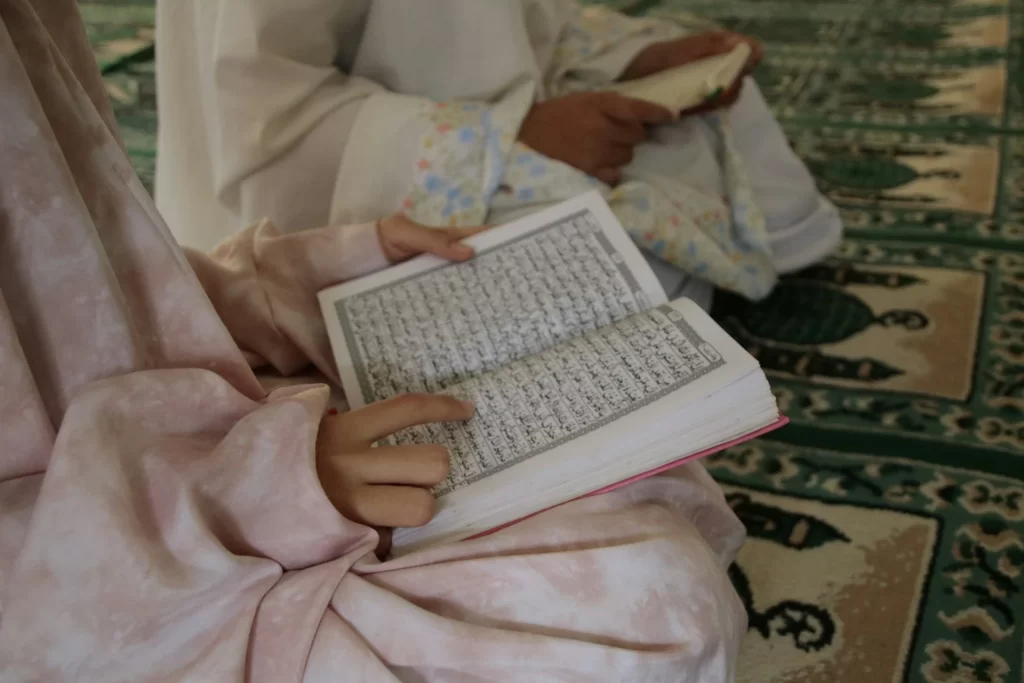 Young child learning Quran reading at early age